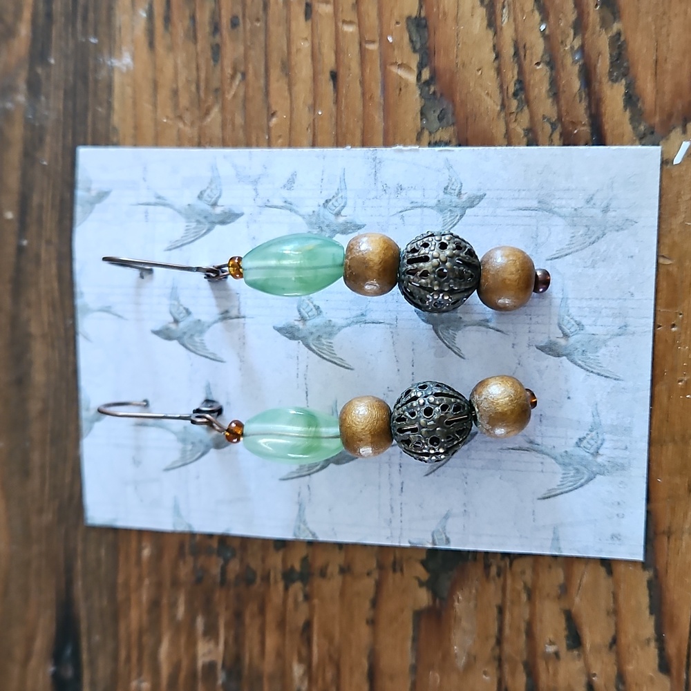Antiqued metal lever close brown and green beaded drop earrings..Measure 2.5